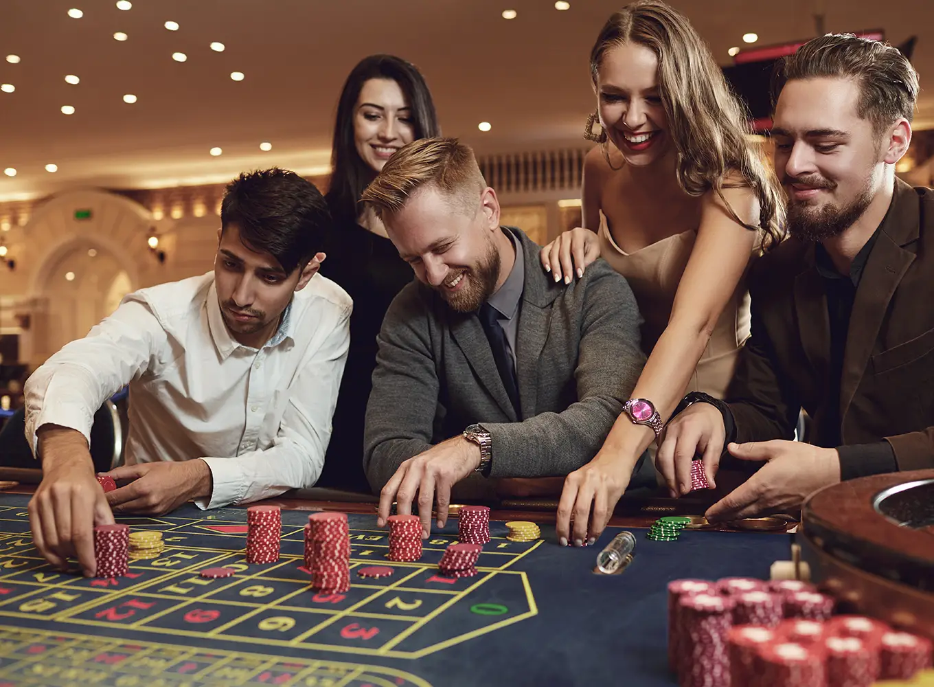 Group of friends playing roulette at a casino, highlighting the social aspects and temptations of gambling