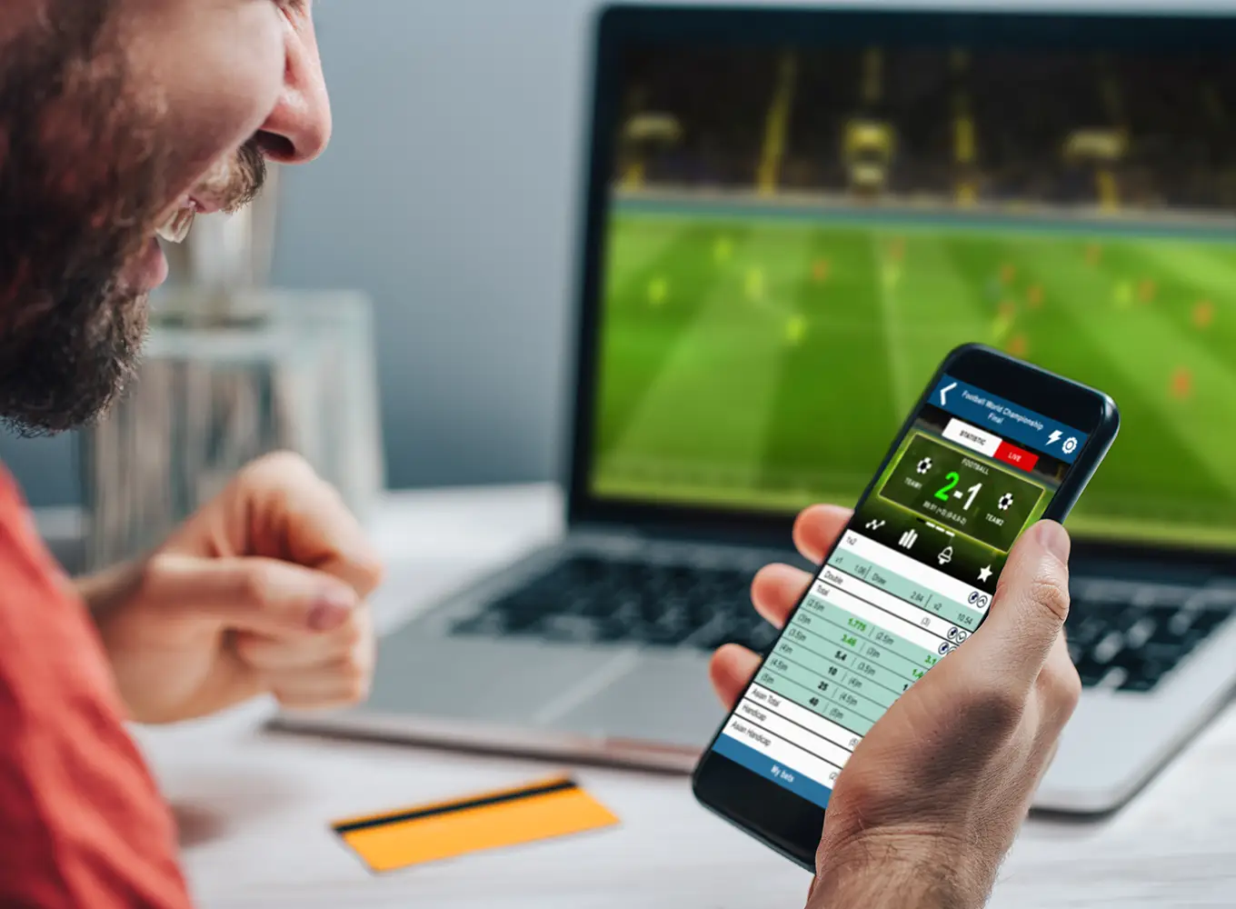 man betting on a live bet for a soccer game