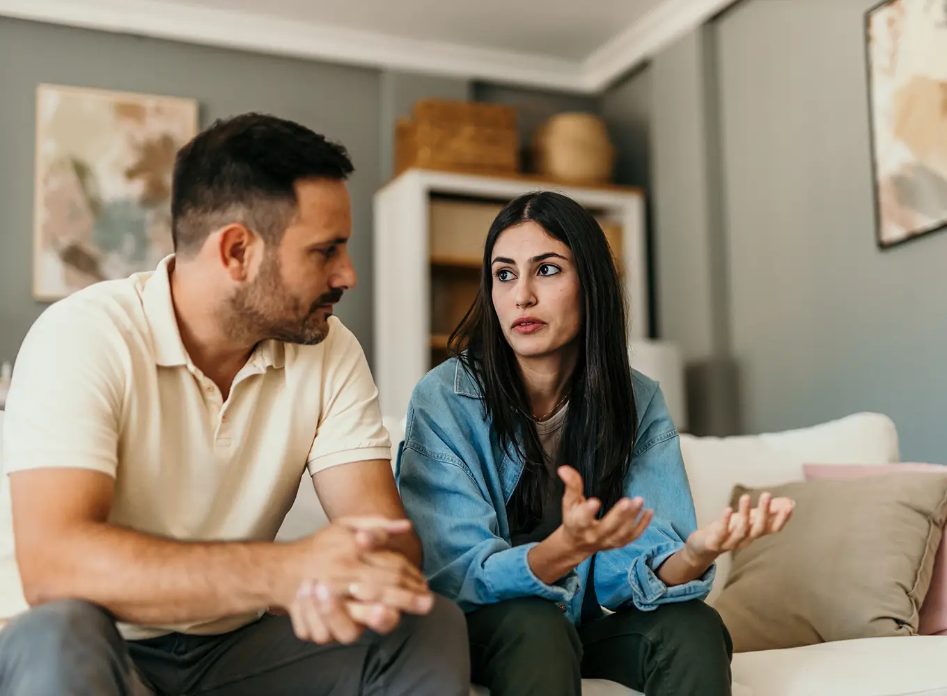 wife calmly talking to her husband about his problem gambling